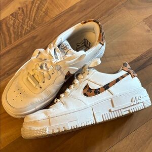 Nike White Sneakers with Leopard Swoosh Accent
